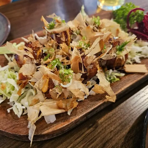 Takoyaki topped with bonito flakes